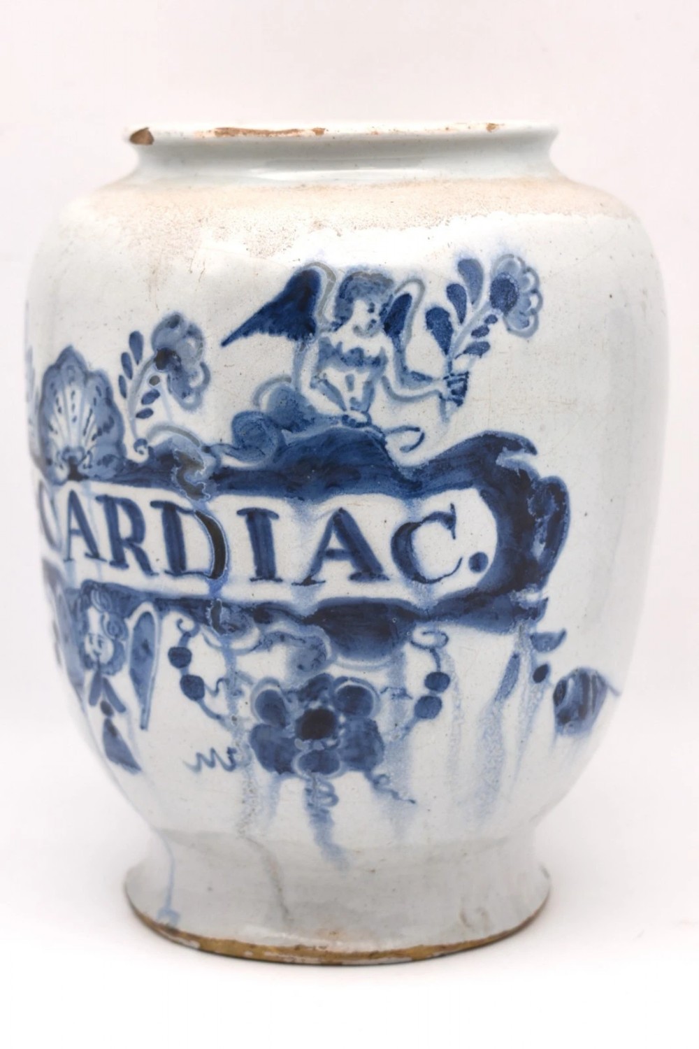 An 18th-century tin-glazed earthenware delftware drug jar featuring hand-painted cobalt blue cartouche decoration with cherubs and the Latin inscription CONF CARDIAC. View III