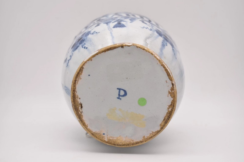 An 18th-century tin-glazed earthenware delftware drug jar featuring hand-painted cobalt blue cartouche decoration with cherubs and the Latin inscription CONF CARDIAC. View VI