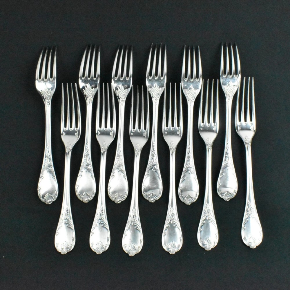 A 52-piece silver-plated cutlery set arranged neatly inside a red velvet-lined presentation case. View VIII