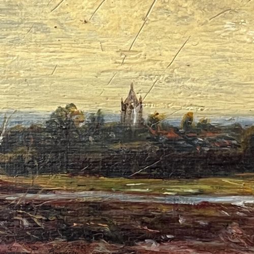 fig 3. A 19th-century oil painting featuring a figure walking along a dirt pathway towards a distant church spire under a sky filled with clouds, set within a wide gold frame.