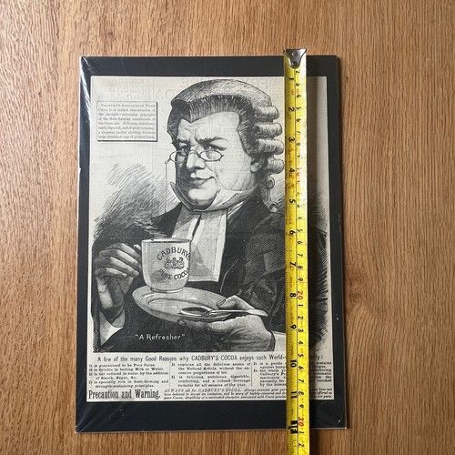 fig 4. A late 19th-century black and white woodcut engraving print advertisement for Cadburys Pure Cocoa featuring a lawyer wearing a wig holding a cup and saucer.