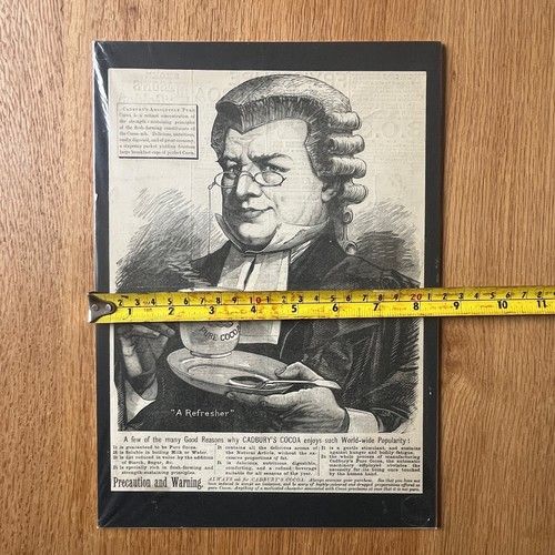 fig 5. A late 19th-century black and white woodcut engraving print advertisement for Cadburys Pure Cocoa featuring a lawyer wearing a wig holding a cup and saucer.