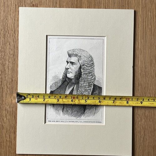 fig 2. An 1871 monochrome wood engraving portrait of a gentleman in a ceremonial judicial wig and coat, mounted in cream card.