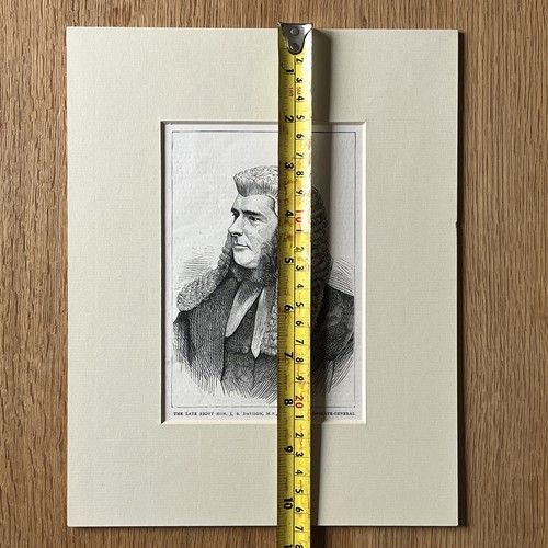 fig 4. An 1871 monochrome wood engraving portrait of a gentleman in a ceremonial judicial wig and coat, mounted in cream card.
