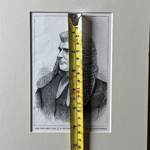 fig 5. An 1871 monochrome wood engraving portrait of a gentleman in a ceremonial judicial wig and coat, mounted in cream card.