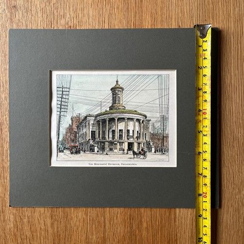 fig 4. An 1891 hand-coloured wood engraving by Edward Whymper depicting the Merchants Exchange building in Philadelphia set within a dark grey mount.