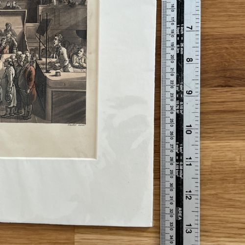fig 7. An 1808 hand-coloured aquatint print illustrating the interior of the Old Bailey courtroom filled with figures, mounted in a white card window.