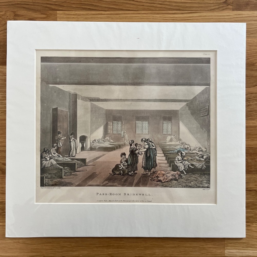 A mounted 1808 hand-coloured aquatint print by Rowlandson and Pugin depicting the Pass-Room at Bridewell with figures in a large interior space.