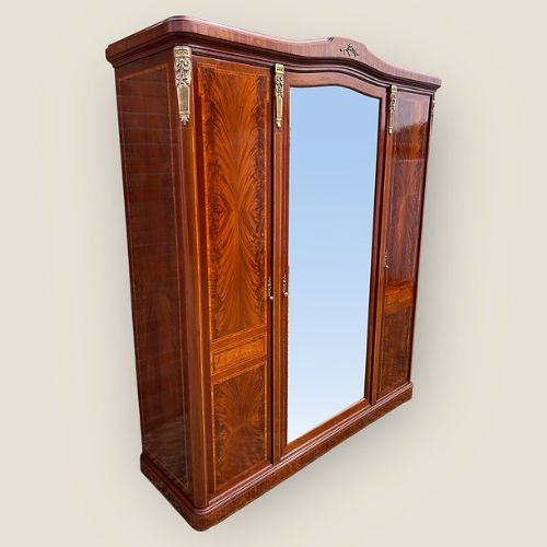 fig 1. Antique French Flame Mahogany 3 Door Wardrobe
