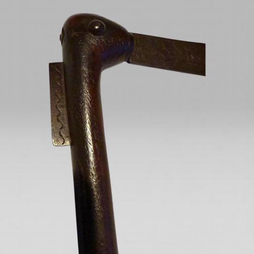 fig 2. A 19th-century Dahomey messenger recade axe featuring an angled hardwood shaft and a flat iron blade.