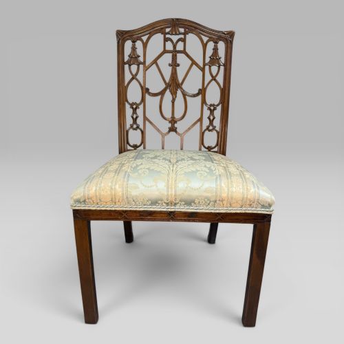 fig 1. A Georgian Chippendale style dark walnut side chair with carved lattice fretwork on the backrest and a pale blue and gold striped damask seat.