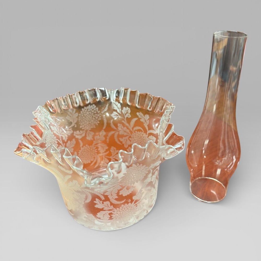 An antique Victorian oil lamp featuring a Corinthian style brass column base, clear glass reservoir, and an etched glass tulip shade with a frilled top rim. View XIII