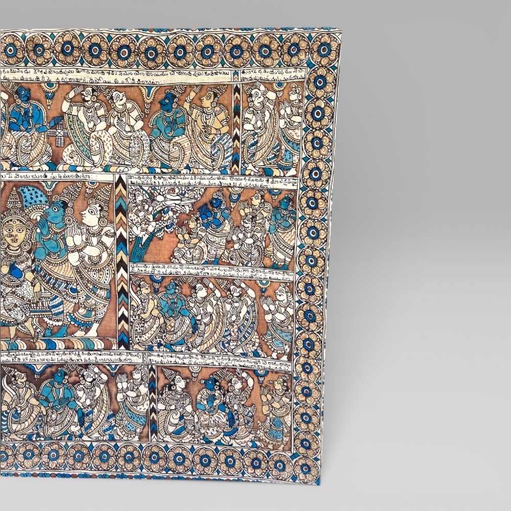 A rectangular Indian Kalamkari cotton textile displaying narrative panels filled with hand-drawn Hindu deities framed by a decorative floral border in blue, beige, and terracotta tones. View III
