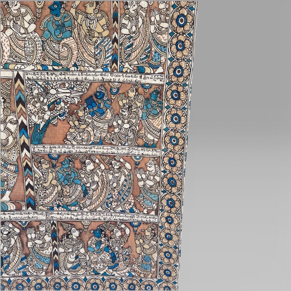 A rectangular Indian Kalamkari cotton textile displaying narrative panels filled with hand-drawn Hindu deities framed by a decorative floral border in blue, beige, and terracotta tones. View VIII