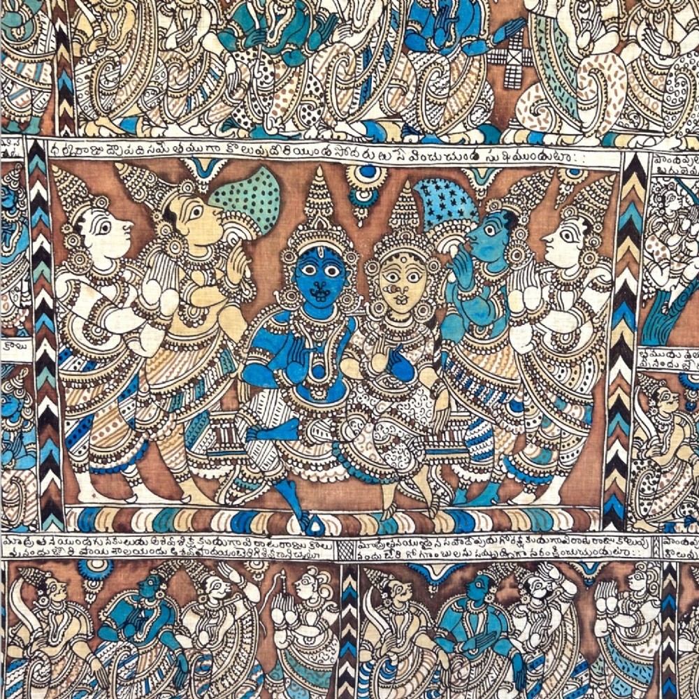A rectangular Indian Kalamkari cotton textile displaying narrative panels filled with hand-drawn Hindu deities framed by a decorative floral border in blue, beige, and terracotta tones. View XIII