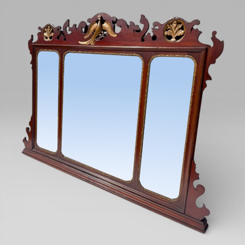 A 19th-century Chippendale style mahogany wall mirror featuring three glass panels, gilt trim, carved shell medallions, and a central gilded bird cresting. View III