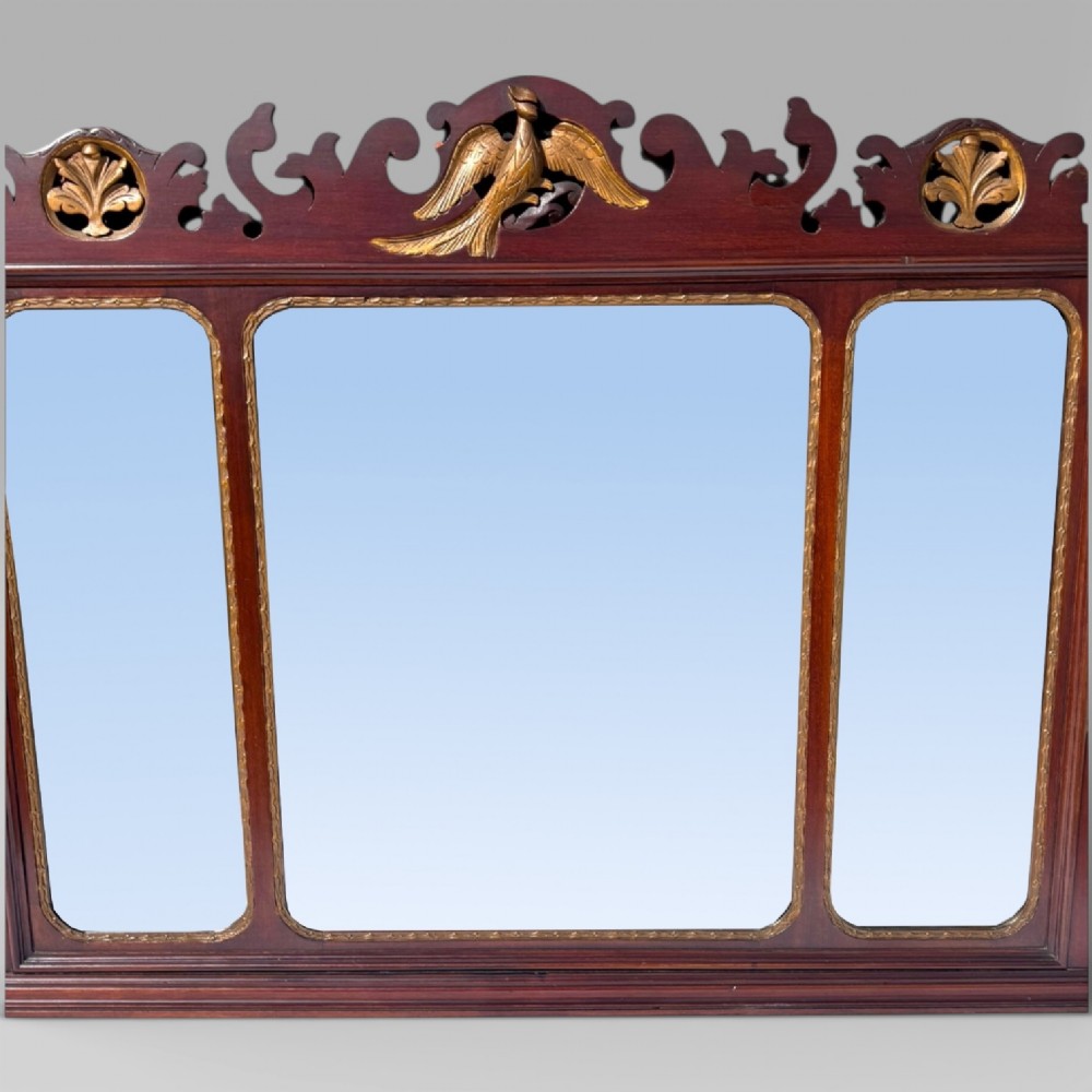 A 19th-century Chippendale style mahogany wall mirror featuring three glass panels, gilt trim, carved shell medallions, and a central gilded bird cresting. View V