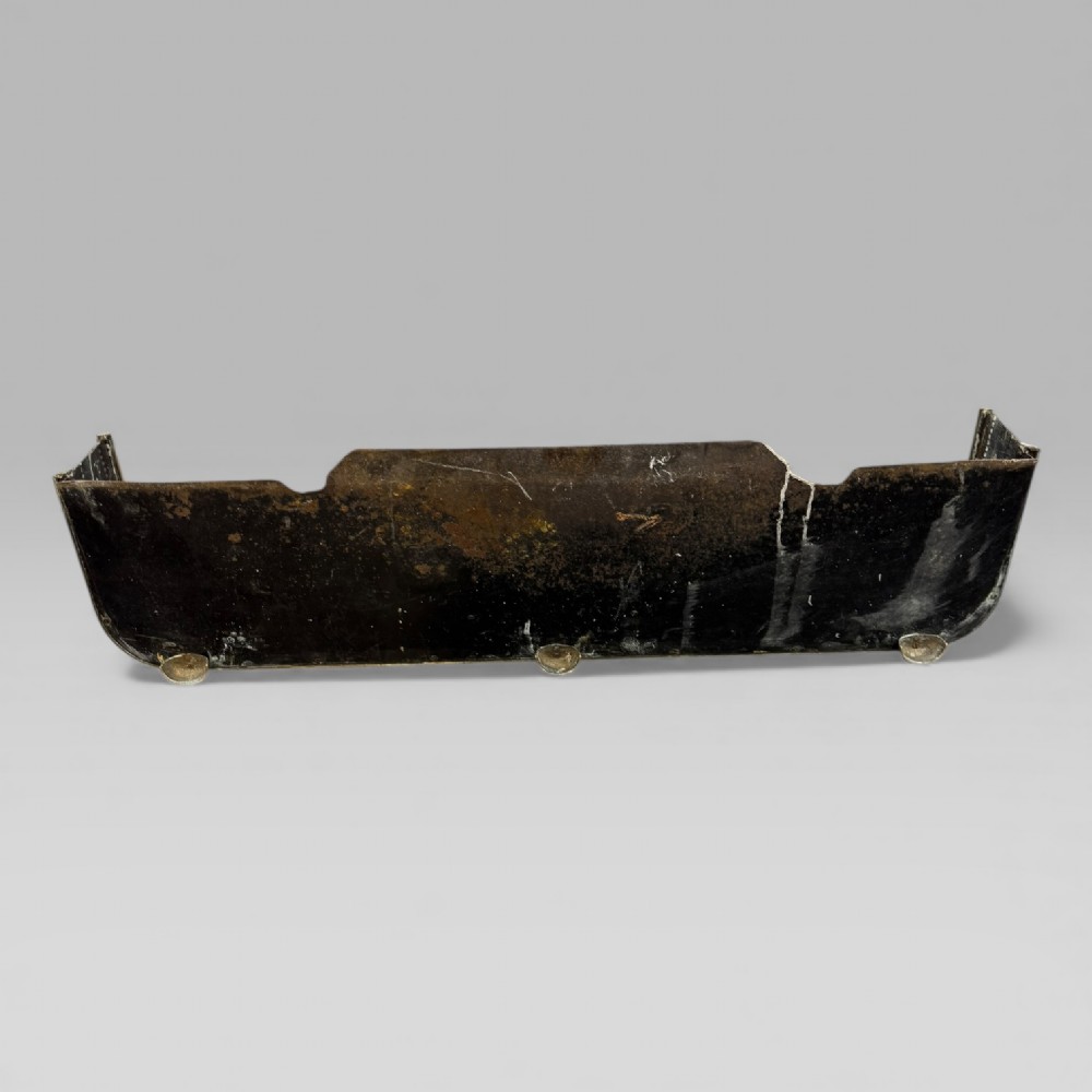A long Victorian brass fire fender featuring a pierced lattice pattern, beaded edge trim, and low support feet. View VI