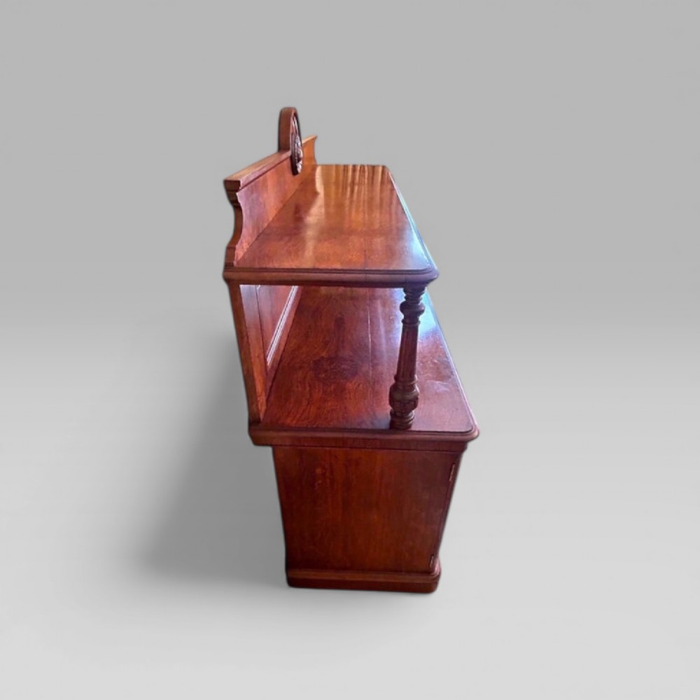 Victorian pollard oak three door buffet sideboard featuring a raised upper shelf supported by turned pillars and panelled cupboard doors with carved circular bosses. View IV