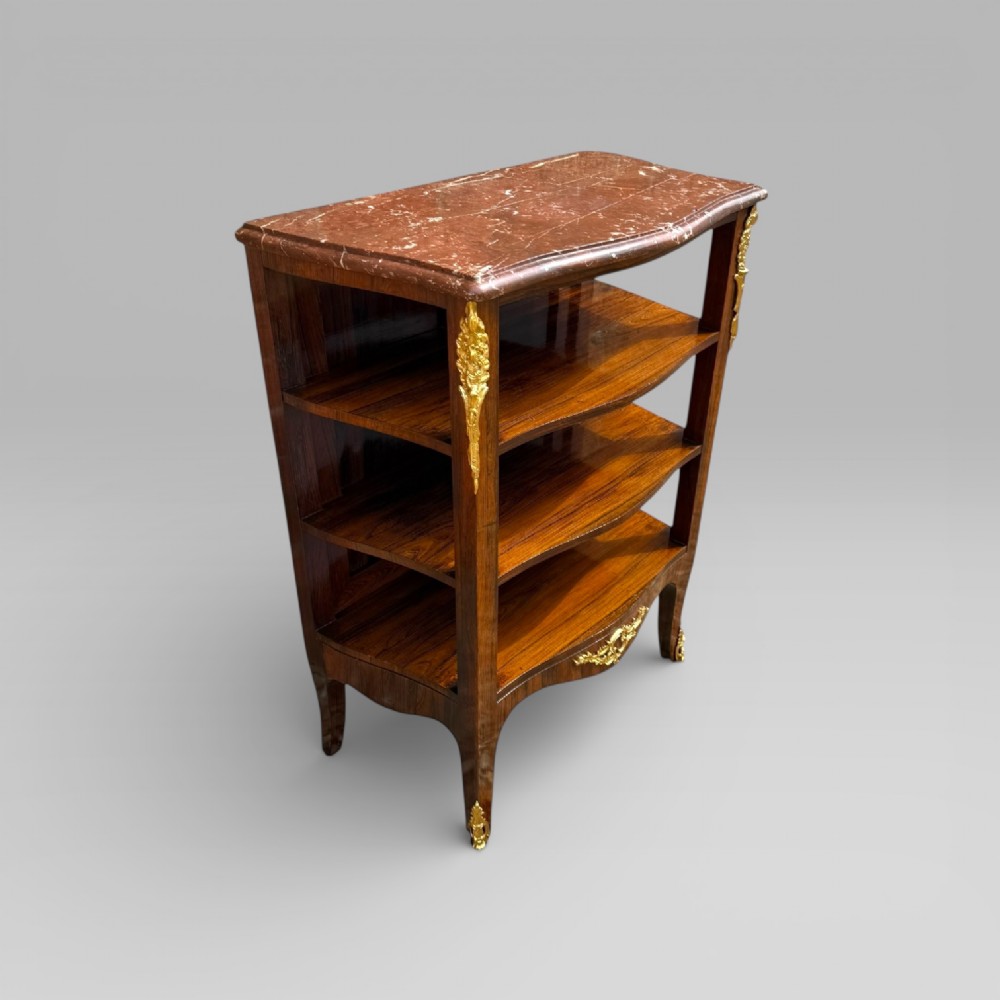 A French Louis XV style rosewood open side cabinet featuring a red marble top, three tiered shelves, and decorative brass ormolu mounts. View III