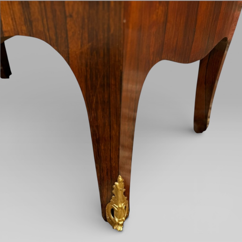 A French Louis XV style rosewood open side cabinet featuring a red marble top, three tiered shelves, and decorative brass ormolu mounts. View IX