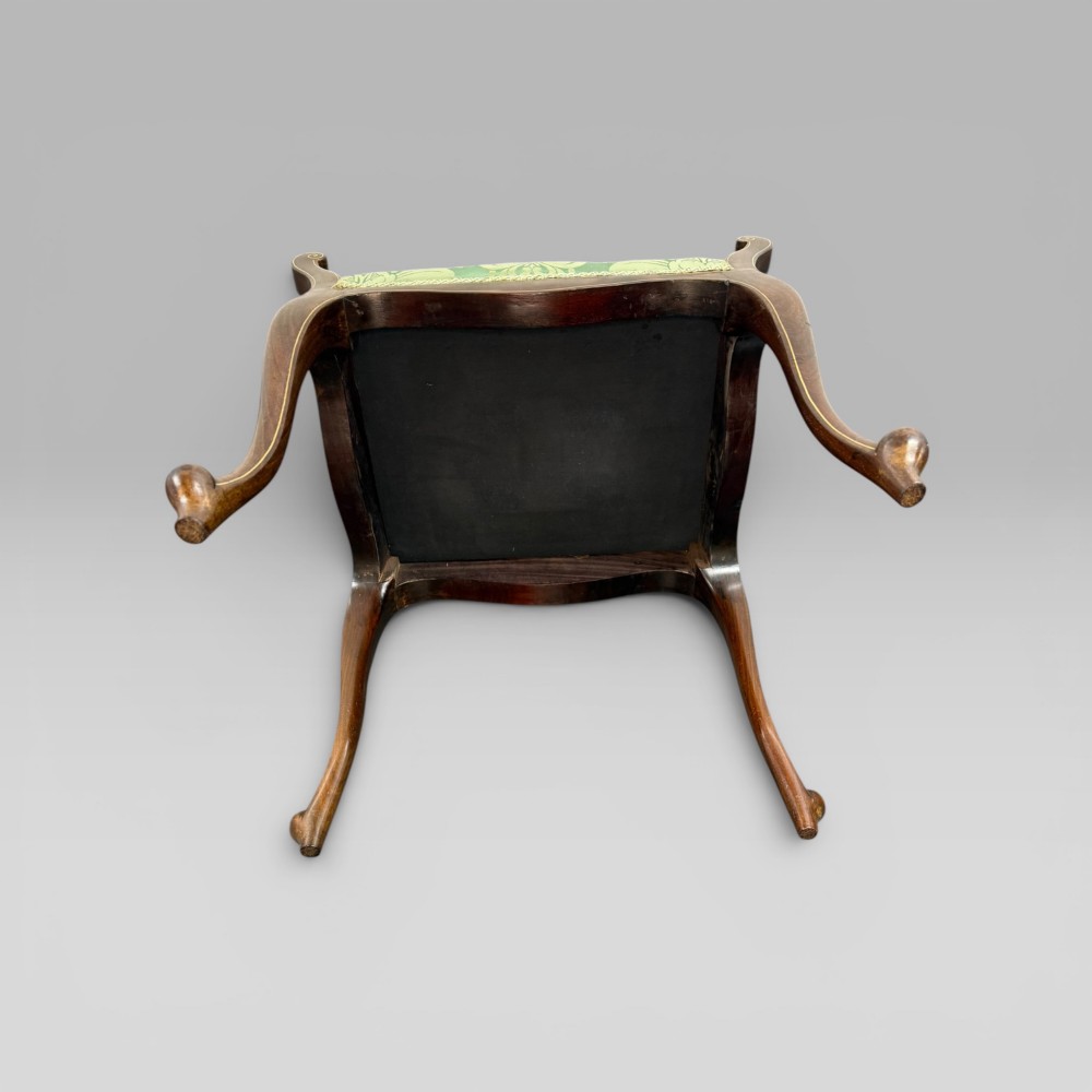 An antique mahogany piano stool featuring cabriole legs, fine line inlay, turned handles, and green floral damask upholstered seating. View VIII
