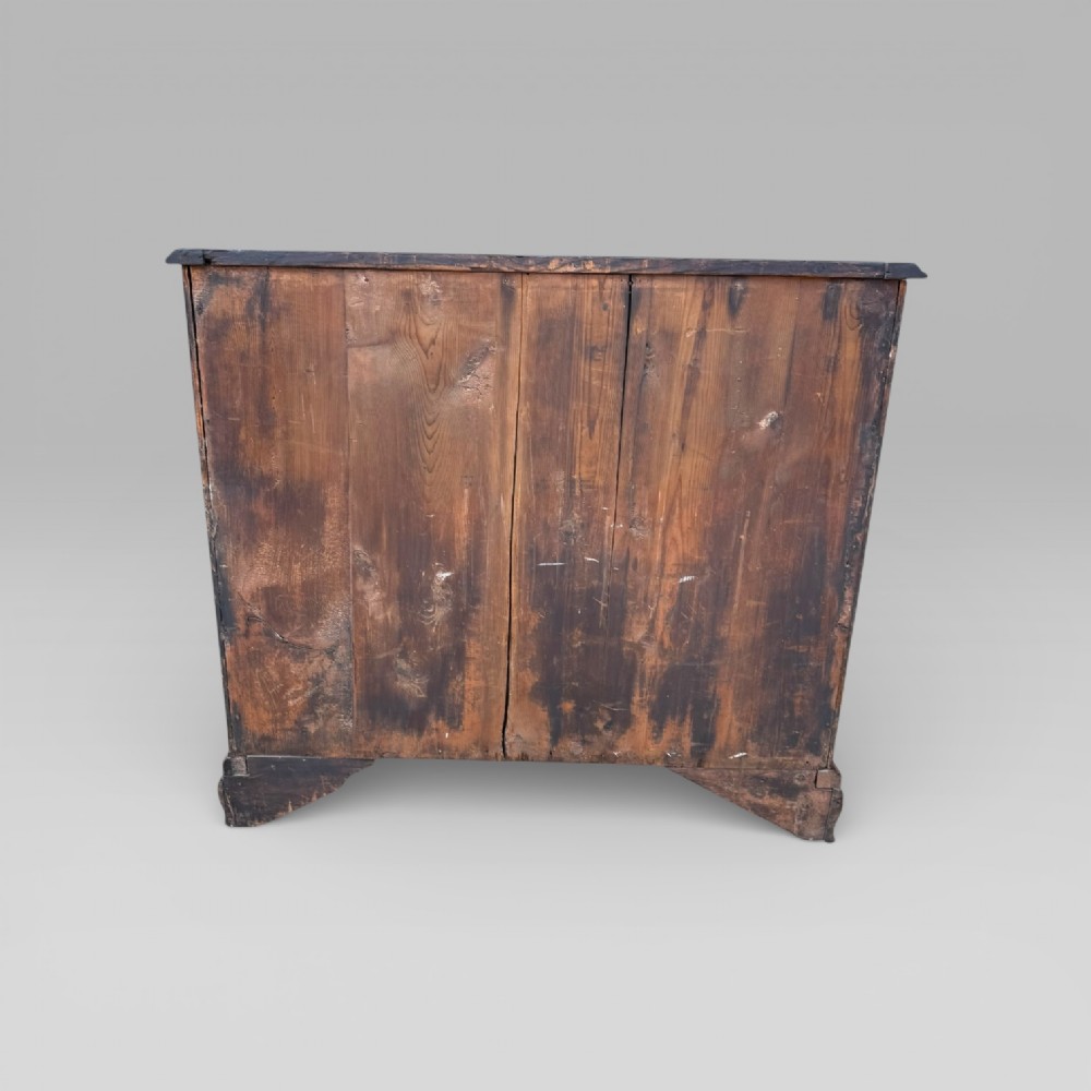 A late 18th-century George III mahogany chest of drawers featuring two short over three long drawers with brass swan-neck handles and bracket feet. View XIII