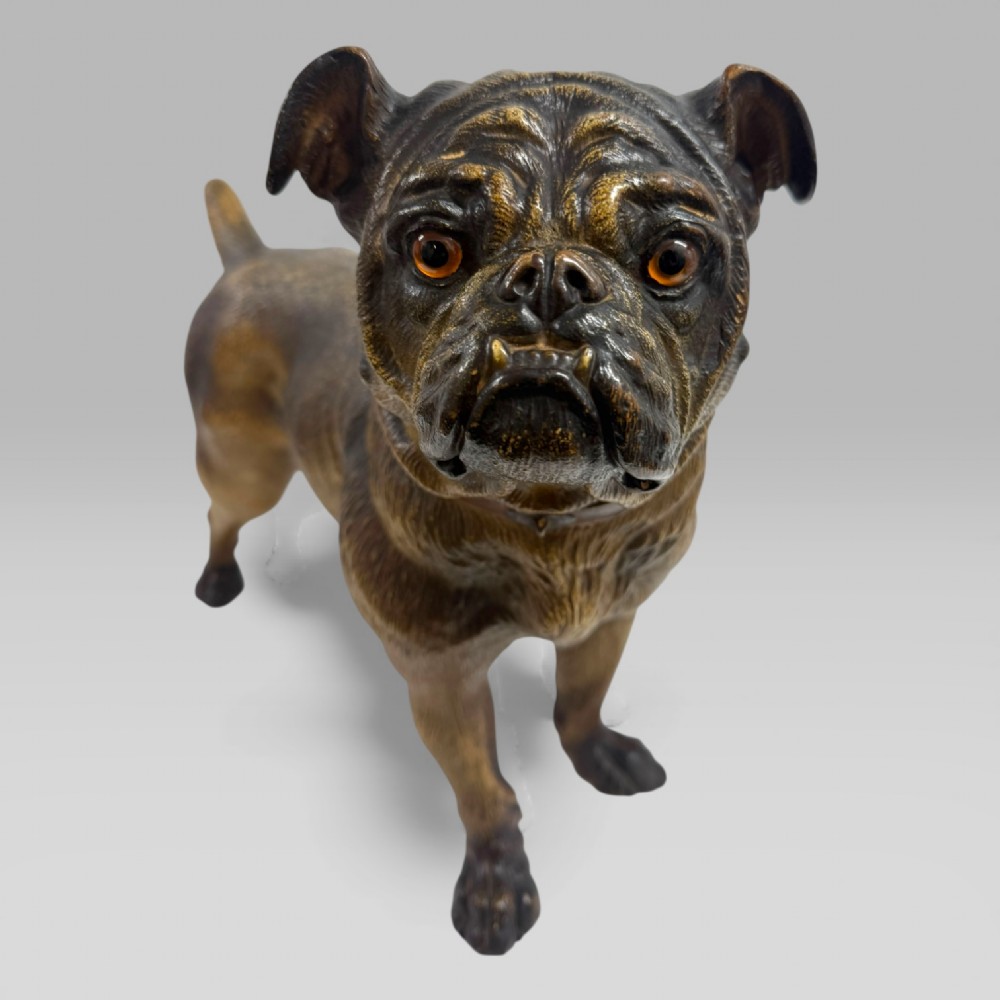 A life-size antique Austrian terracotta sculpture of a standing pug dog with inset glass eyes and a moulded collar. View III