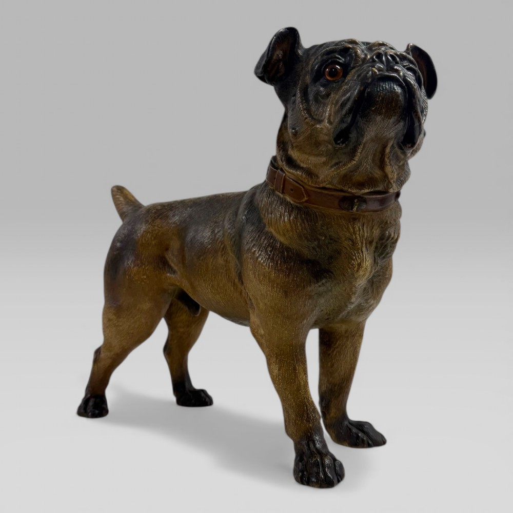 A life-size antique Austrian terracotta sculpture of a standing pug dog with inset glass eyes and a moulded collar. View IV