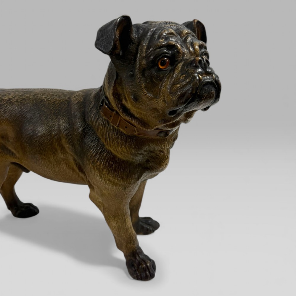 A life-size antique Austrian terracotta sculpture of a standing pug dog with inset glass eyes and a moulded collar. View V