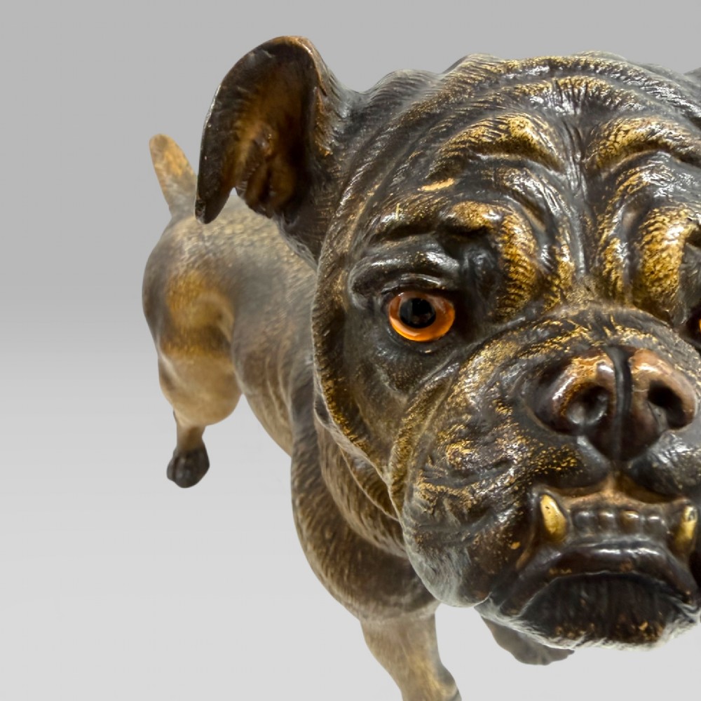 A life-size antique Austrian terracotta sculpture of a standing pug dog with inset glass eyes and a moulded collar. View VI