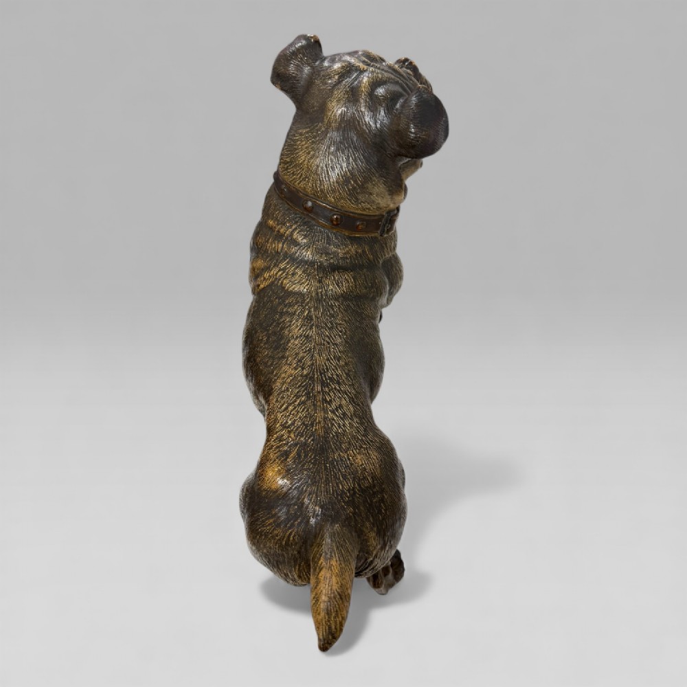 A life-size antique Austrian terracotta sculpture of a standing pug dog with inset glass eyes and a moulded collar. View VII