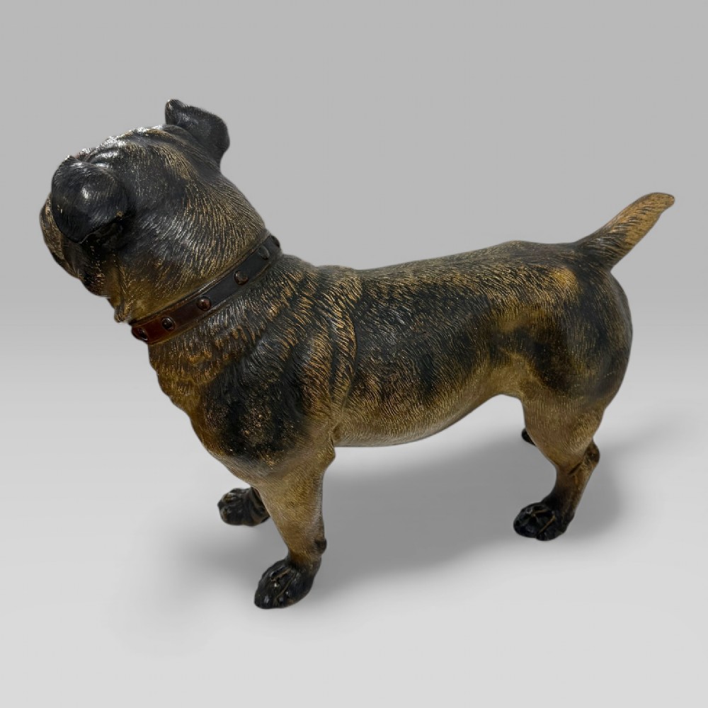 A life-size antique Austrian terracotta sculpture of a standing pug dog with inset glass eyes and a moulded collar. View XI