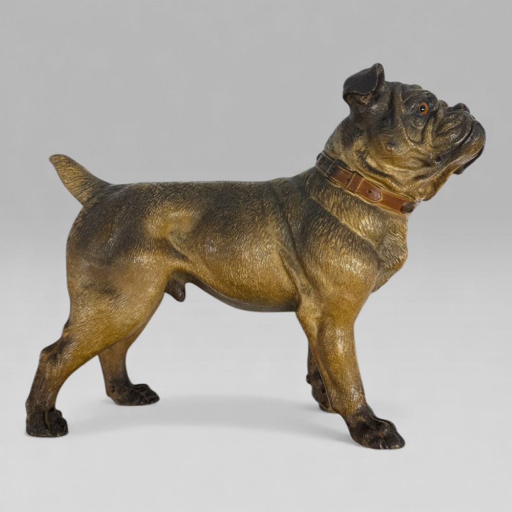 A life-size antique Austrian terracotta sculpture of a standing pug dog with inset glass eyes and a moulded collar. View XII