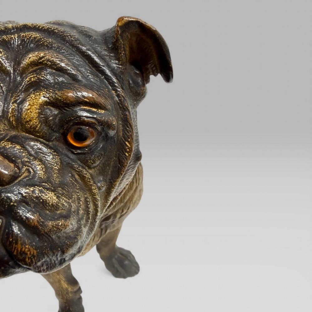 A life-size antique Austrian terracotta sculpture of a standing pug dog with inset glass eyes and a moulded collar. View XV