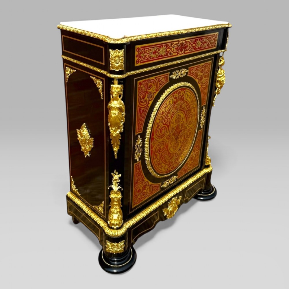 A French Napoleon III ebonised pier cabinet featuring red tortoiseshell and brass Boulle marquetry, gilt bronze mounts, and a white marble top. View IV