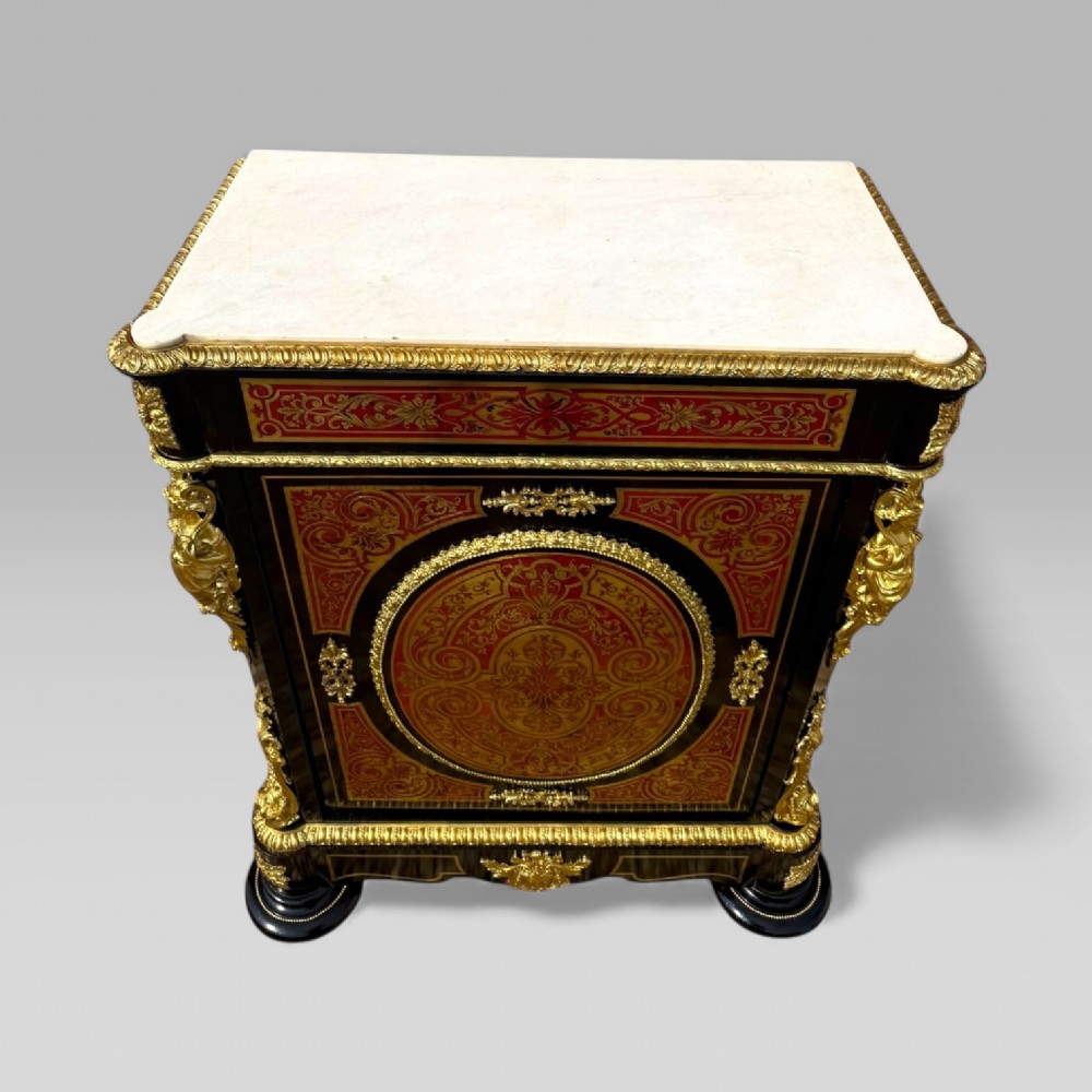 A French Napoleon III ebonised pier cabinet featuring red tortoiseshell and brass Boulle marquetry, gilt bronze mounts, and a white marble top. View VII