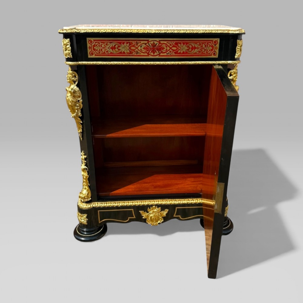 A French Napoleon III ebonised pier cabinet featuring red tortoiseshell and brass Boulle marquetry, gilt bronze mounts, and a white marble top. View X
