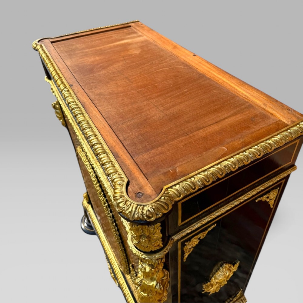 A French Napoleon III ebonised pier cabinet featuring red tortoiseshell and brass Boulle marquetry, gilt bronze mounts, and a white marble top. View XII