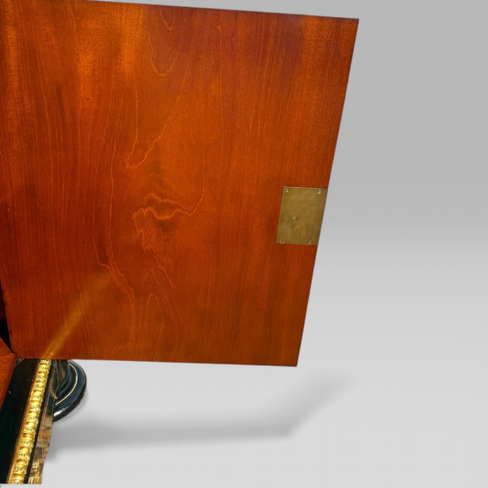 A French Napoleon III ebonised pier cabinet featuring red tortoiseshell and brass Boulle marquetry, gilt bronze mounts, and a white marble top. View XIV