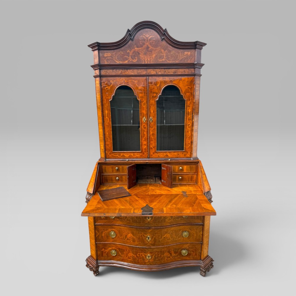 A mid-18th-century Italian Venetian bureau bookcase featuring detailed marquetry inlay, arched glazed doors, a slant-front writing desk, and three serpentine lower drawers. View III