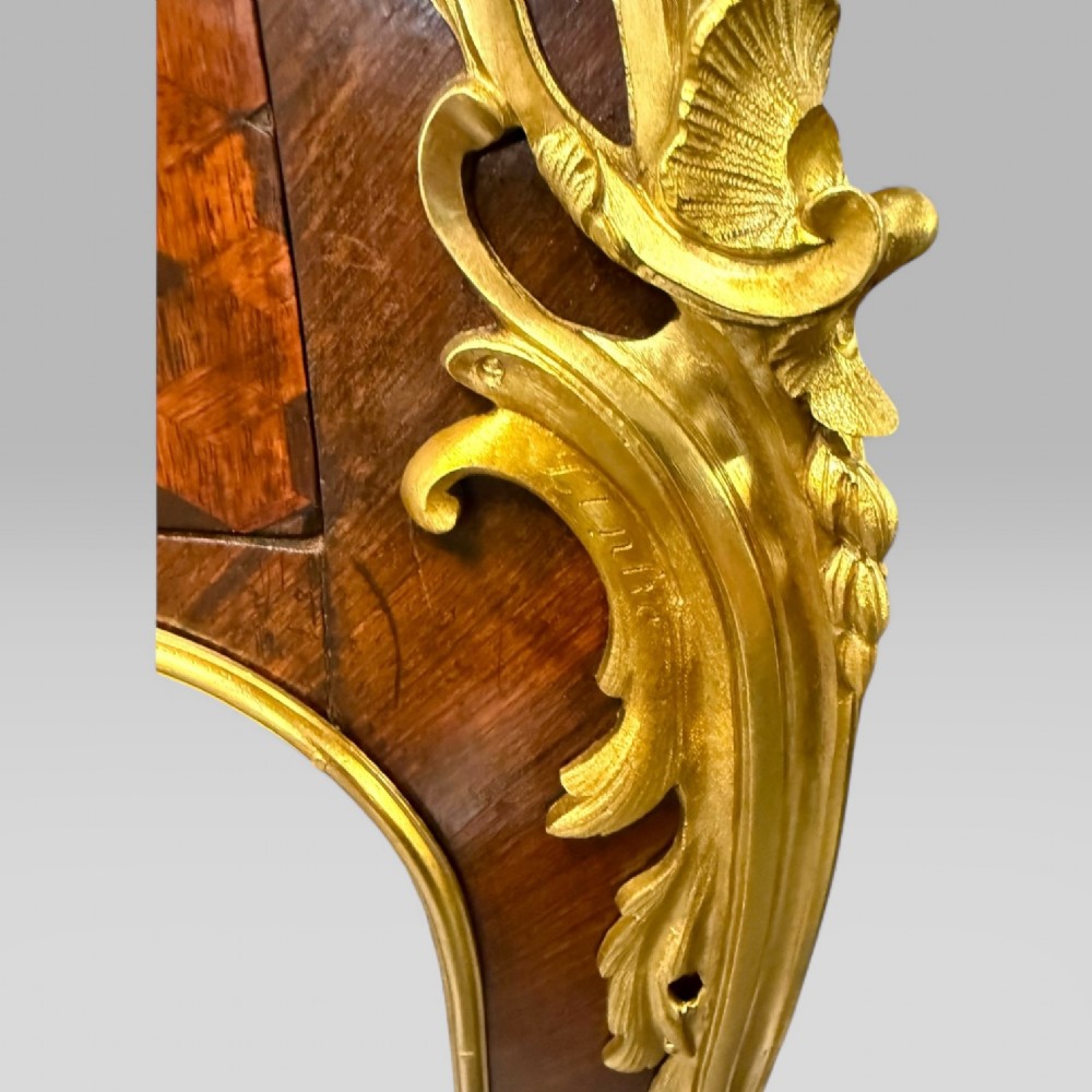 A late nineteenth-century French kingwood bureau plat featuring parquetry veneers, gilt bronze ormolu mounts, cabriole legs, and a brown leather inset writing surface. View VI