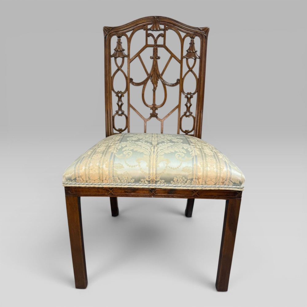 A Georgian Chippendale style dark walnut side chair with carved lattice fretwork on the backrest and a pale blue and gold striped damask seat. View II