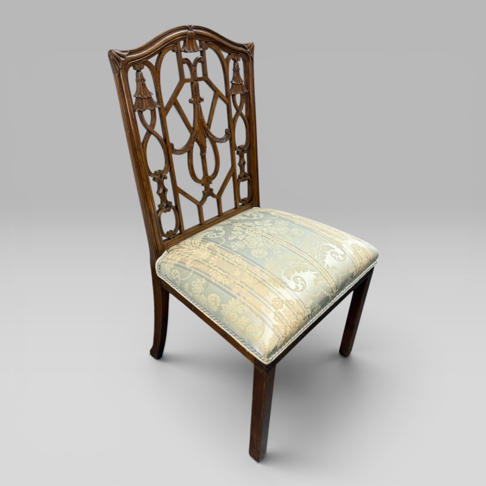 A Georgian Chippendale style dark walnut side chair with carved lattice fretwork on the backrest and a pale blue and gold striped damask seat. View III
