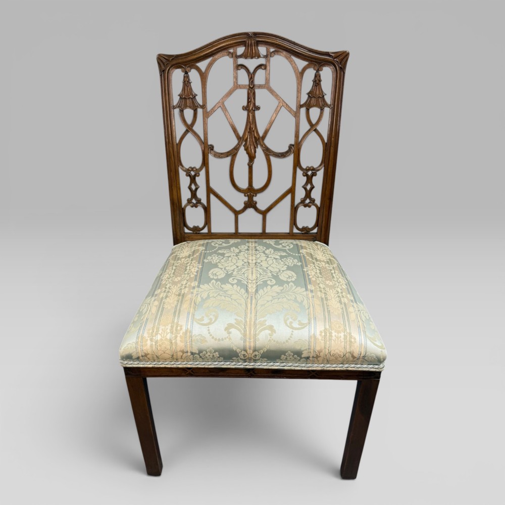 A Georgian Chippendale style dark walnut side chair with carved lattice fretwork on the backrest and a pale blue and gold striped damask seat. View IV
