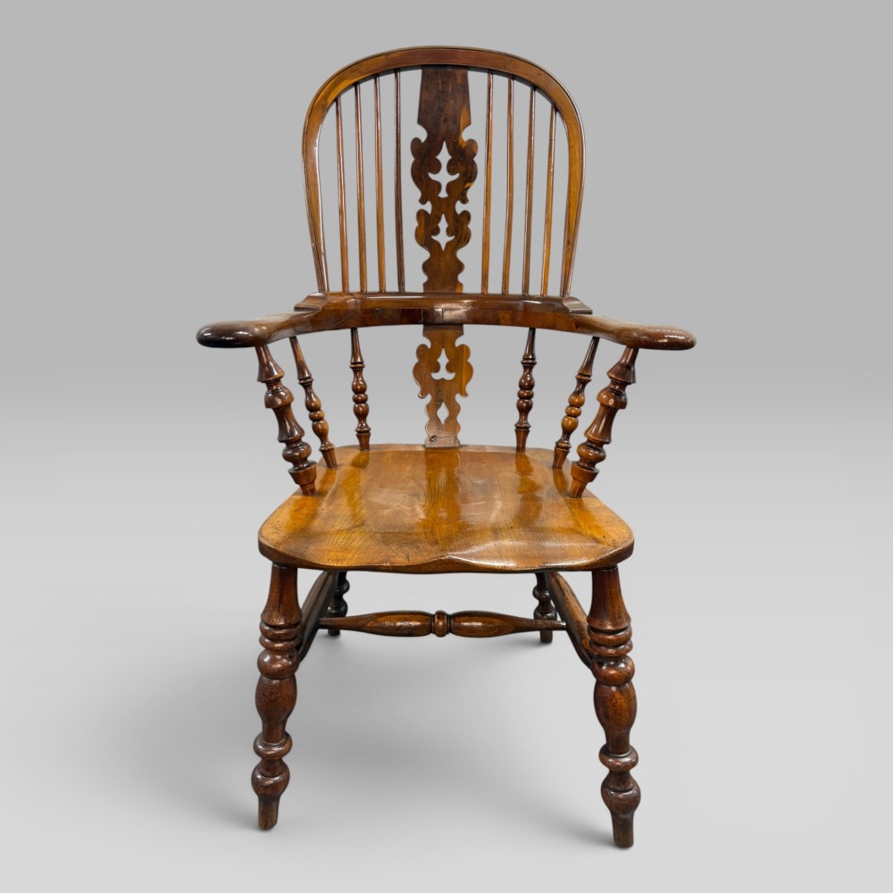 A Victorian high-back Windsor armchair crafted from yew wood and elm with a pierced central splat, spindle back, and turned legs. View II