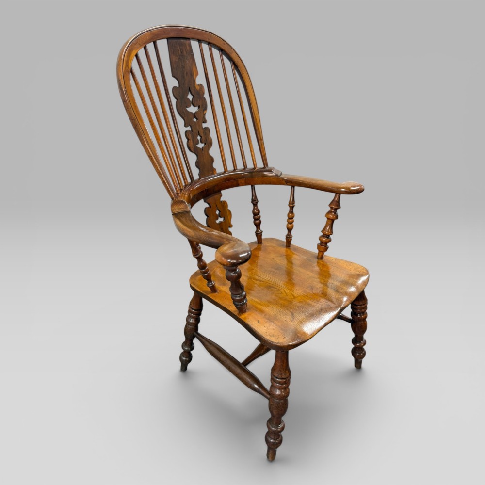 A Victorian high-back Windsor armchair crafted from yew wood and elm with a pierced central splat, spindle back, and turned legs. View III