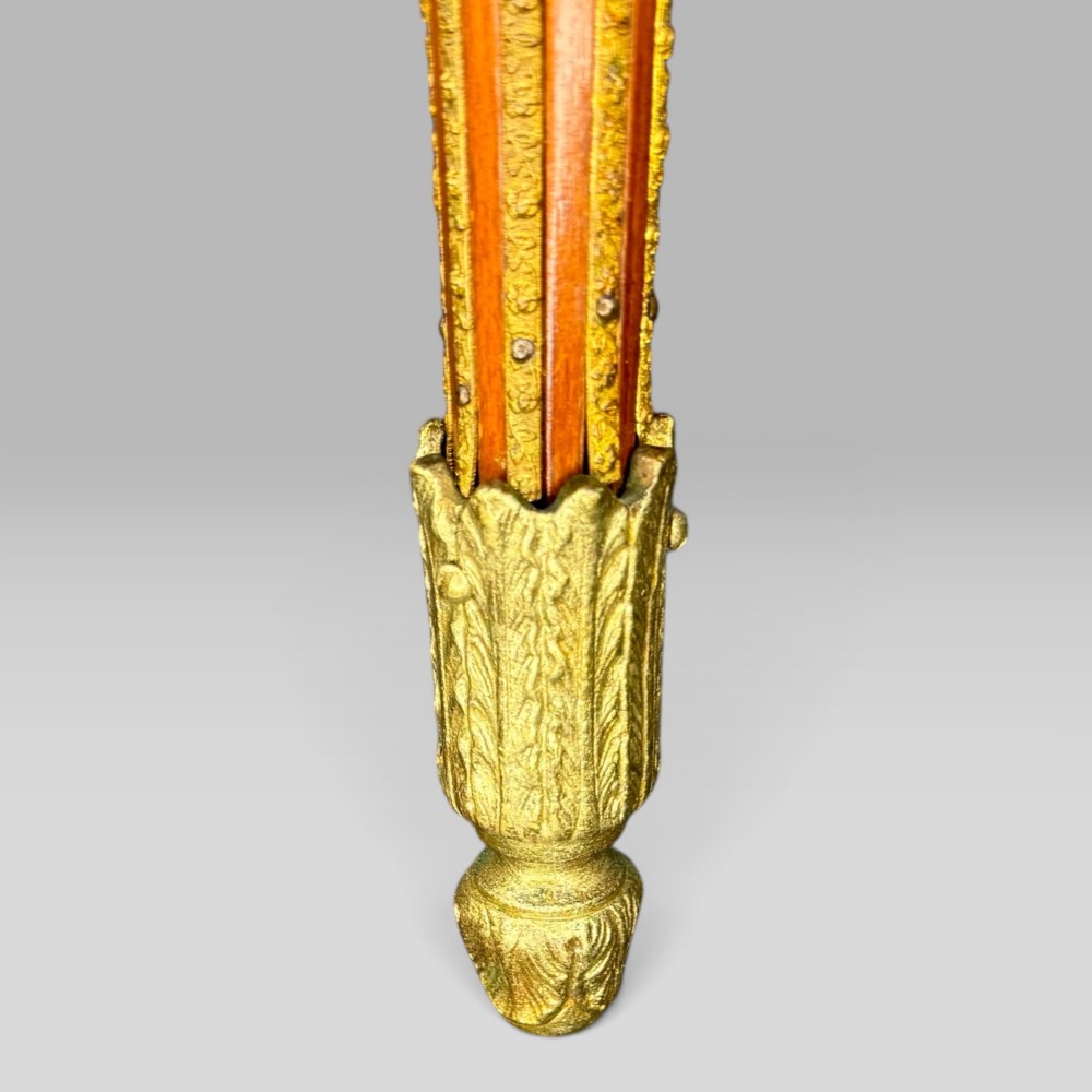 A rectangular French Louis XVI style bijouterie display table featuring a glazed glass top, decorative gilt bronze mounts along the frieze, and slender tapered legs ending in brass sabots. View XIII