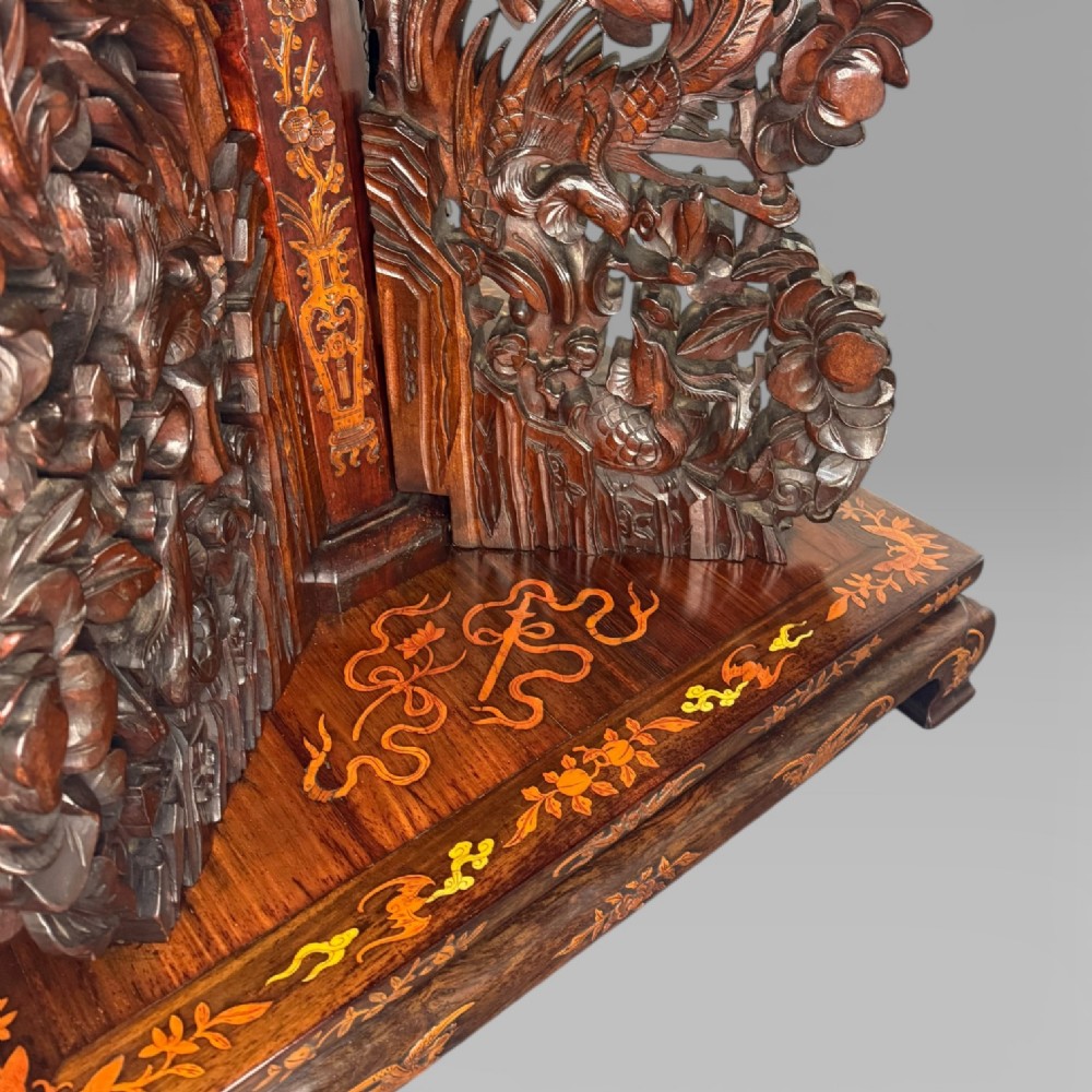 A circular dark rosewood centre table featuring detailed marquetry inlays depicting ships, pagodas, and flora. View VIII