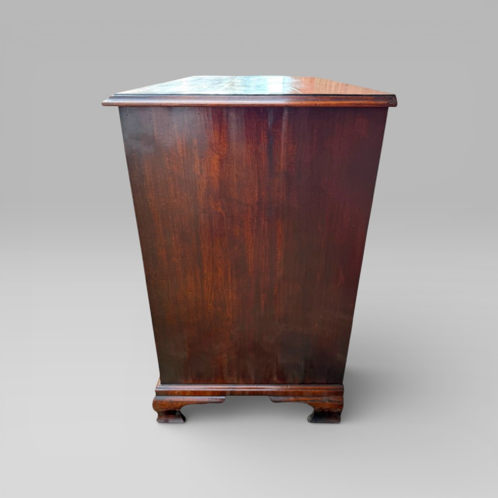 An antique George III mahogany chest of drawers featuring a two-over-three drawer layout, brass swan-neck handles, keyhole escutcheons, and bracket feet. View X